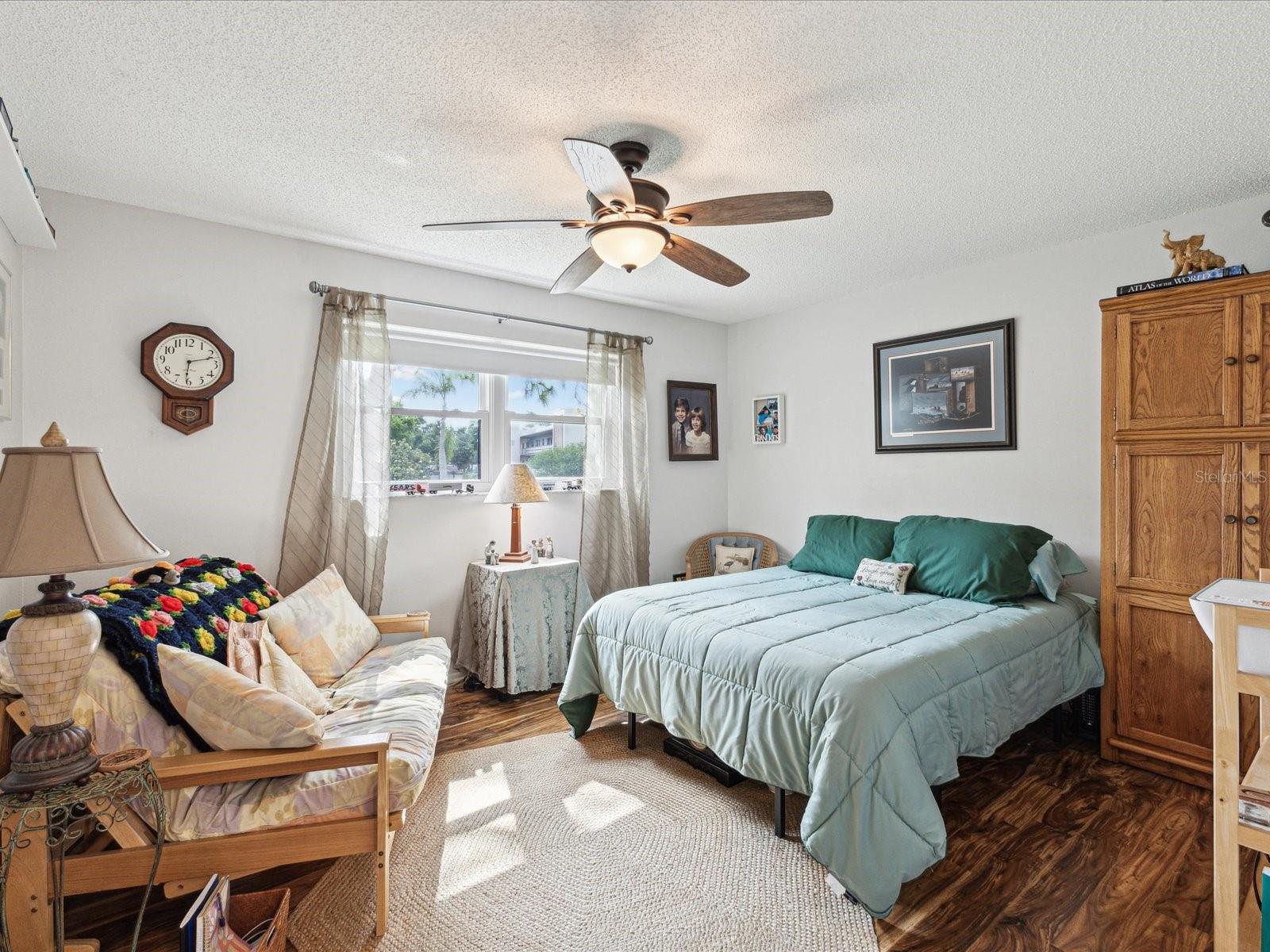 2nd bedroom also offers lots of natural light, walk-in closet and engineered wood floors