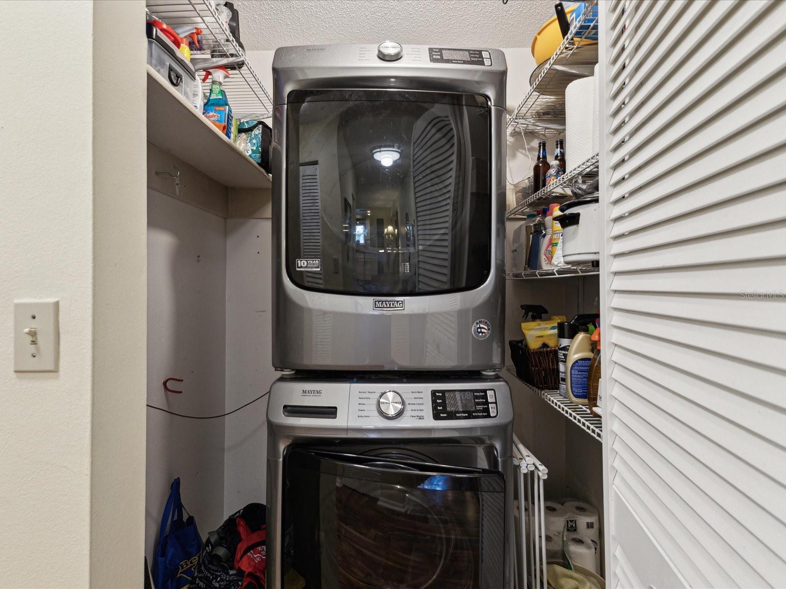Stack washer and dryer will stay with the condo. Extra storage space on each side.