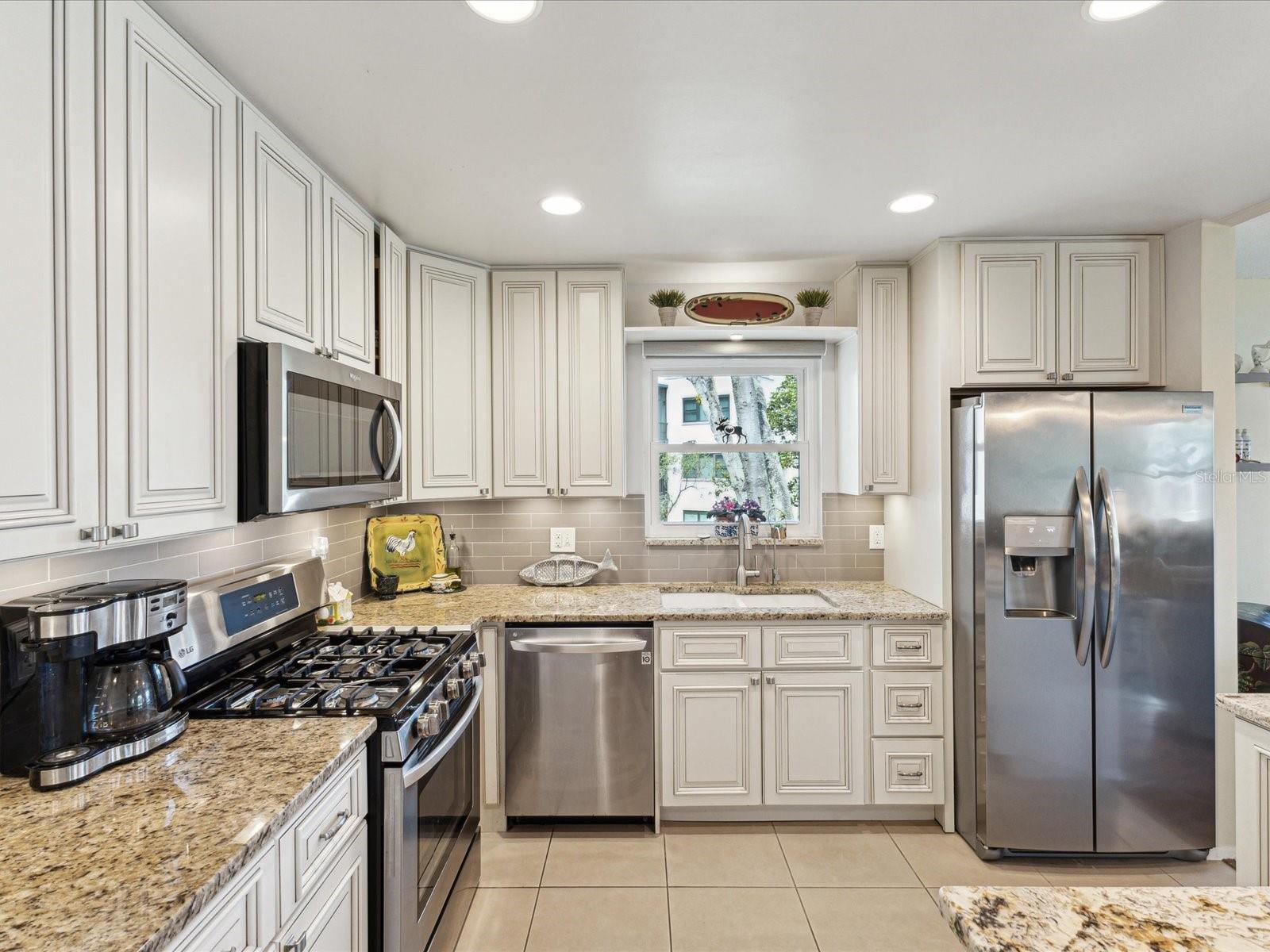 Stainless appliances: Gas Range, Microwave, Dishwasher, Refrigerator. Reverse Osmosis Water Filtration
