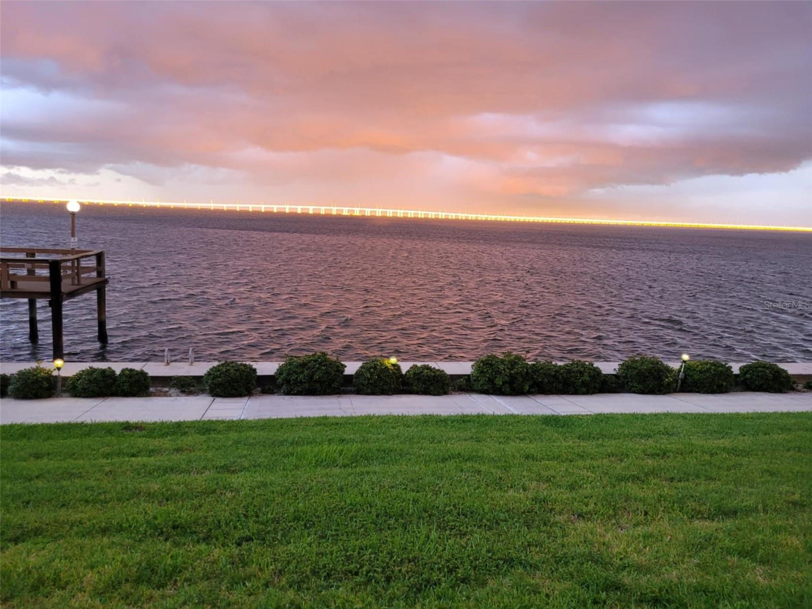 View of Bay and sun reflecting on Bayside Bridge