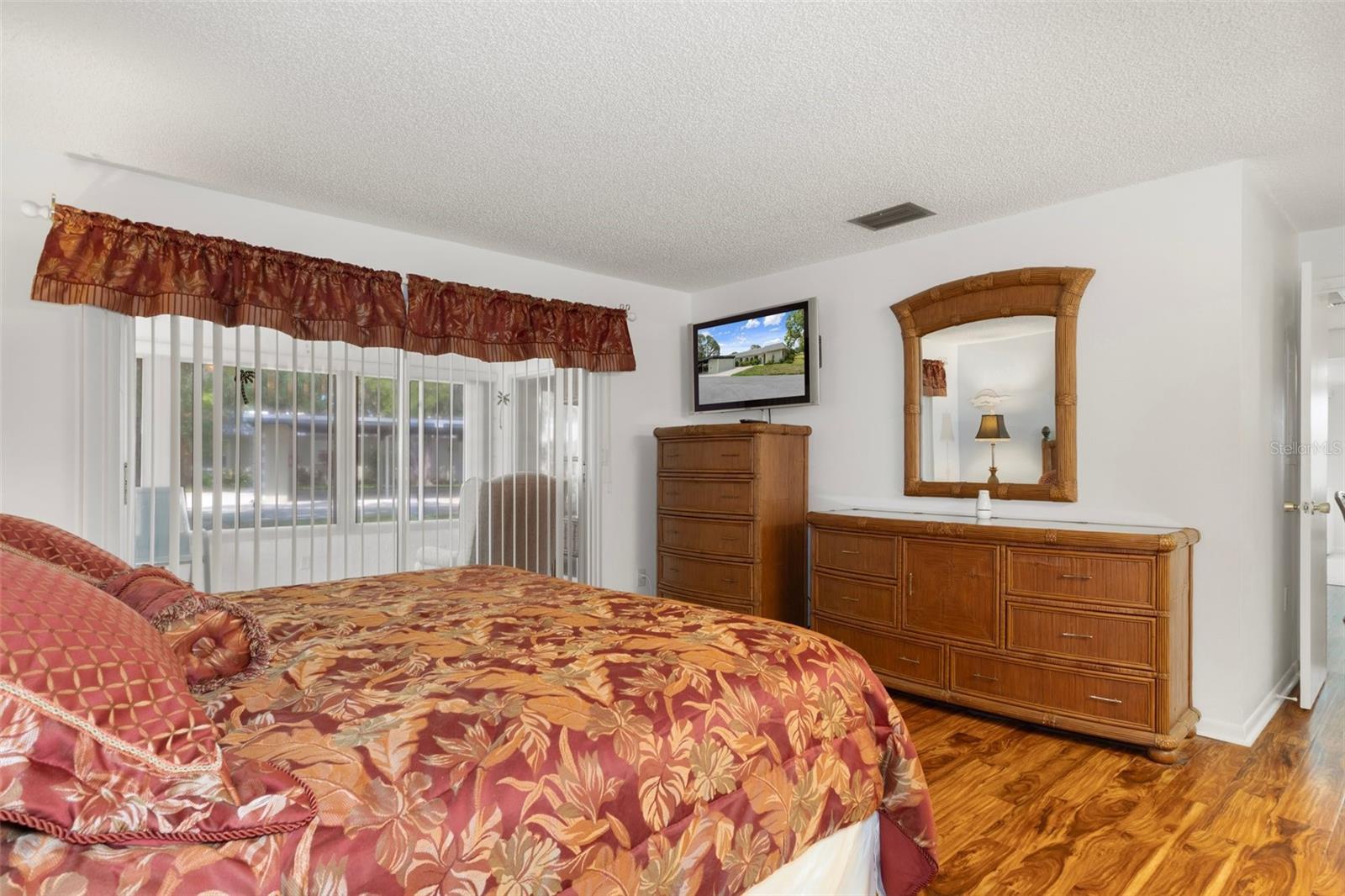 Primary Bedroom with Sliders to Enclosed Florida Room
