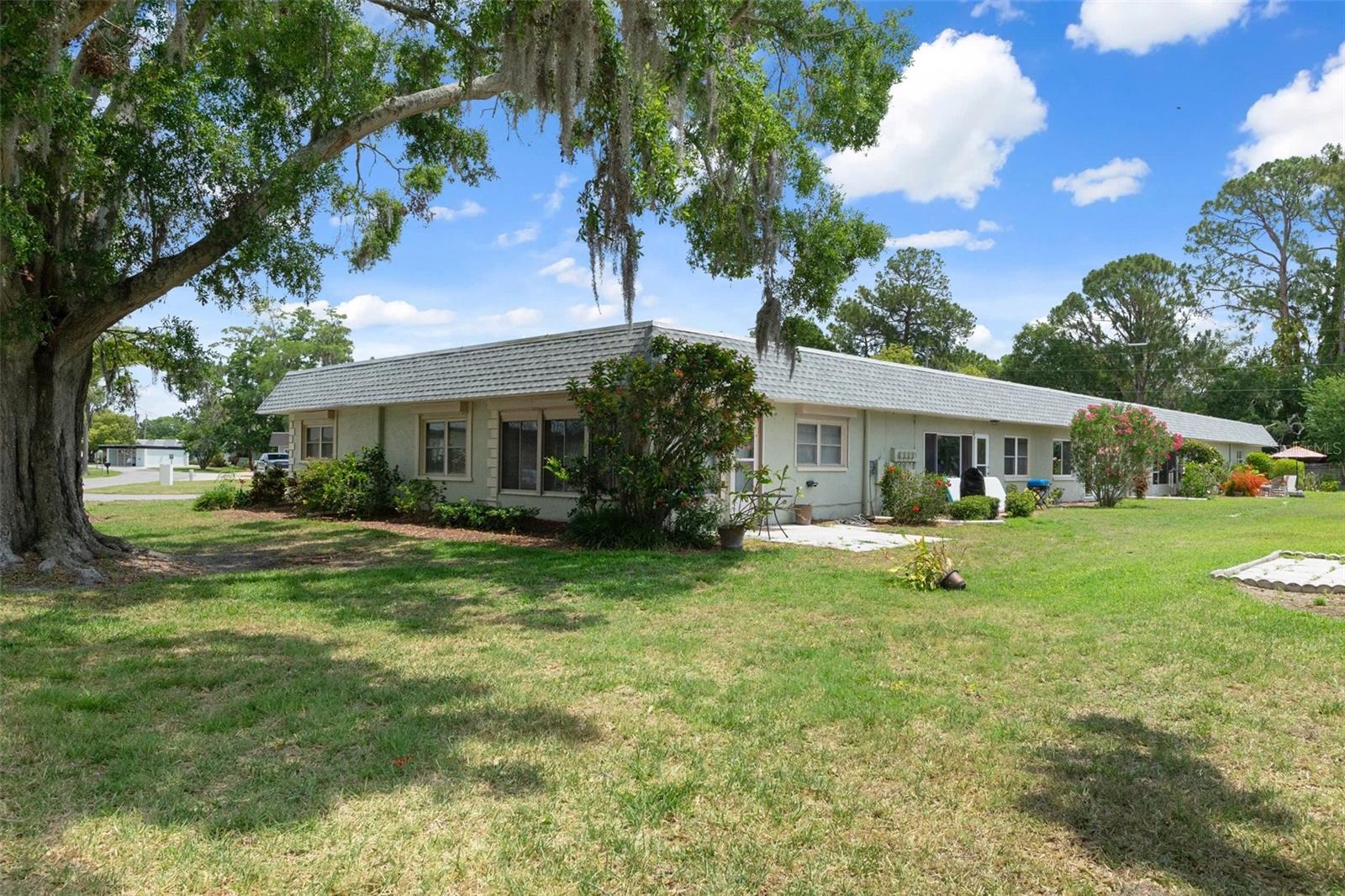 Rear of Home with Beautiful Trees