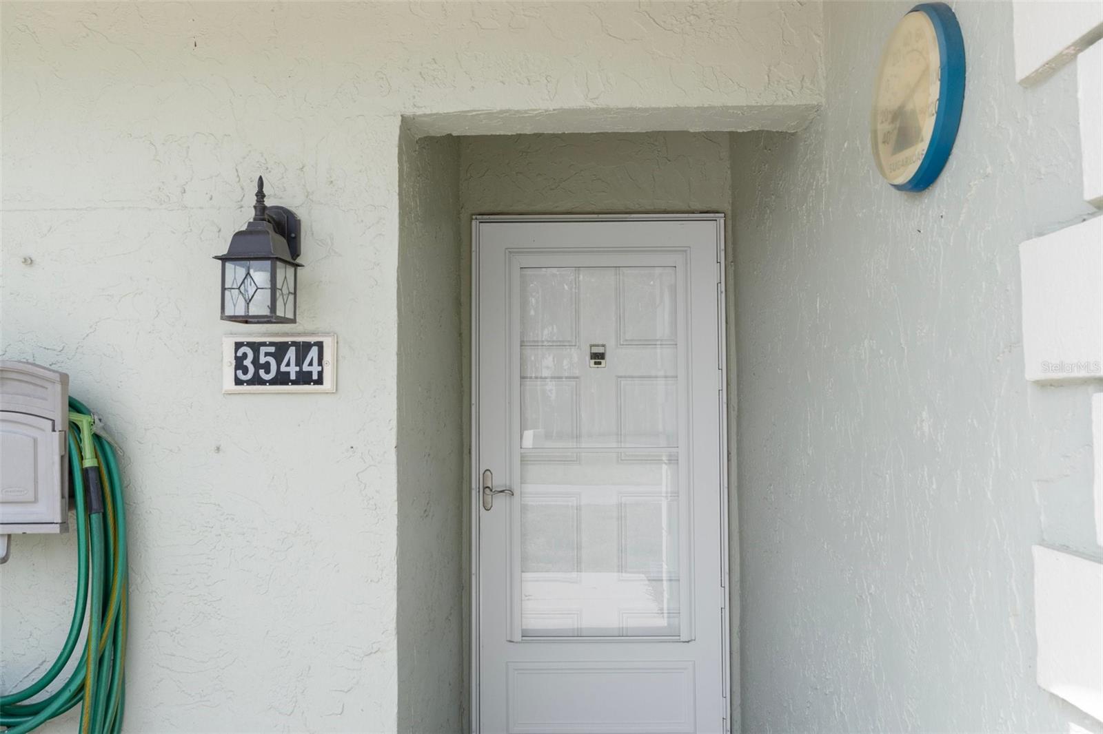 Inviting Front Entry with Glass Storm Door
