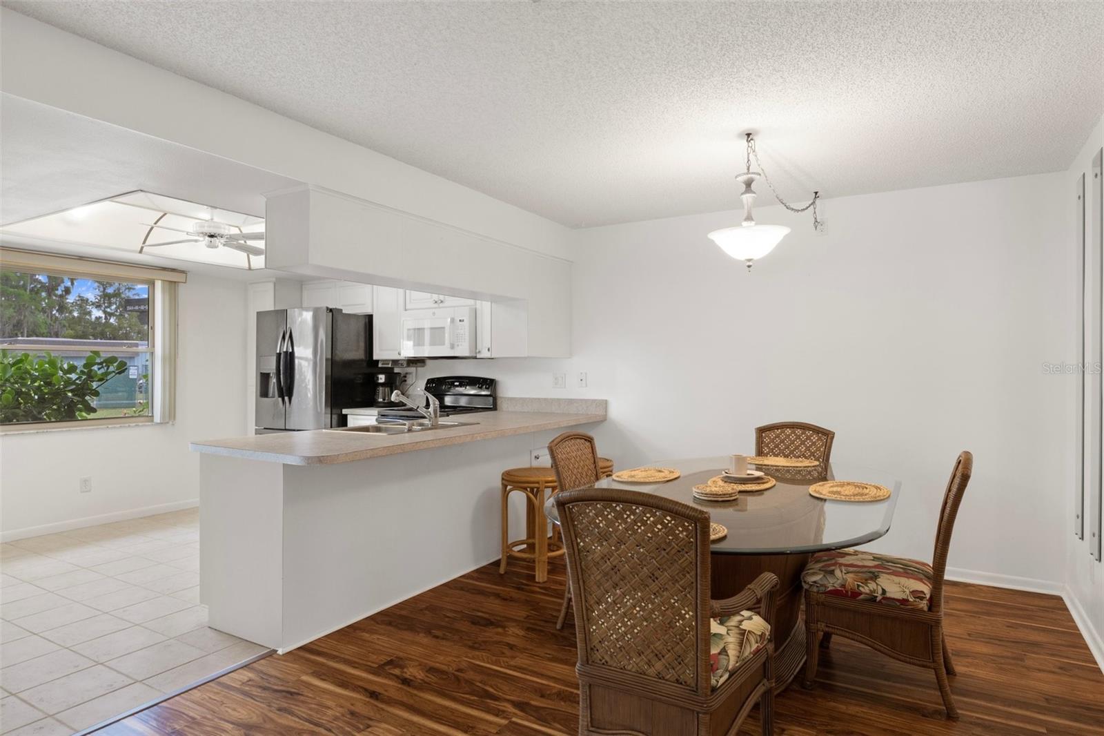 Dining Area with Easy Kitchen Access and Laminate Flooring