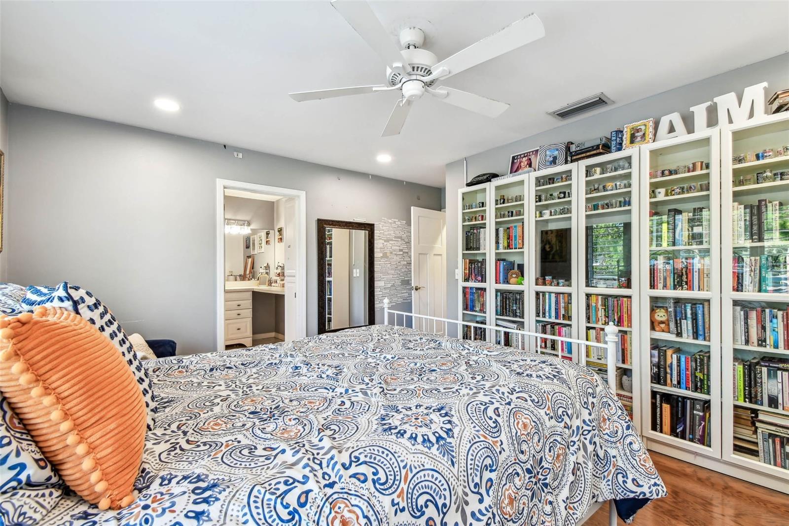 Bedroom 4 w/ En-Suite and Built-In Bookcases