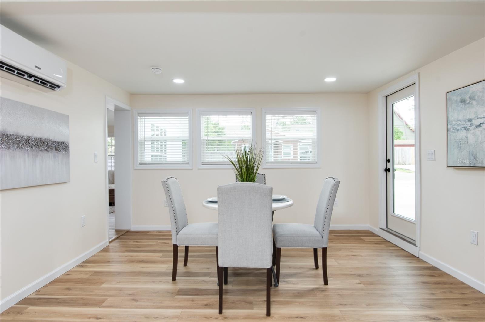 Dining area with view to the front of the house and door to carport