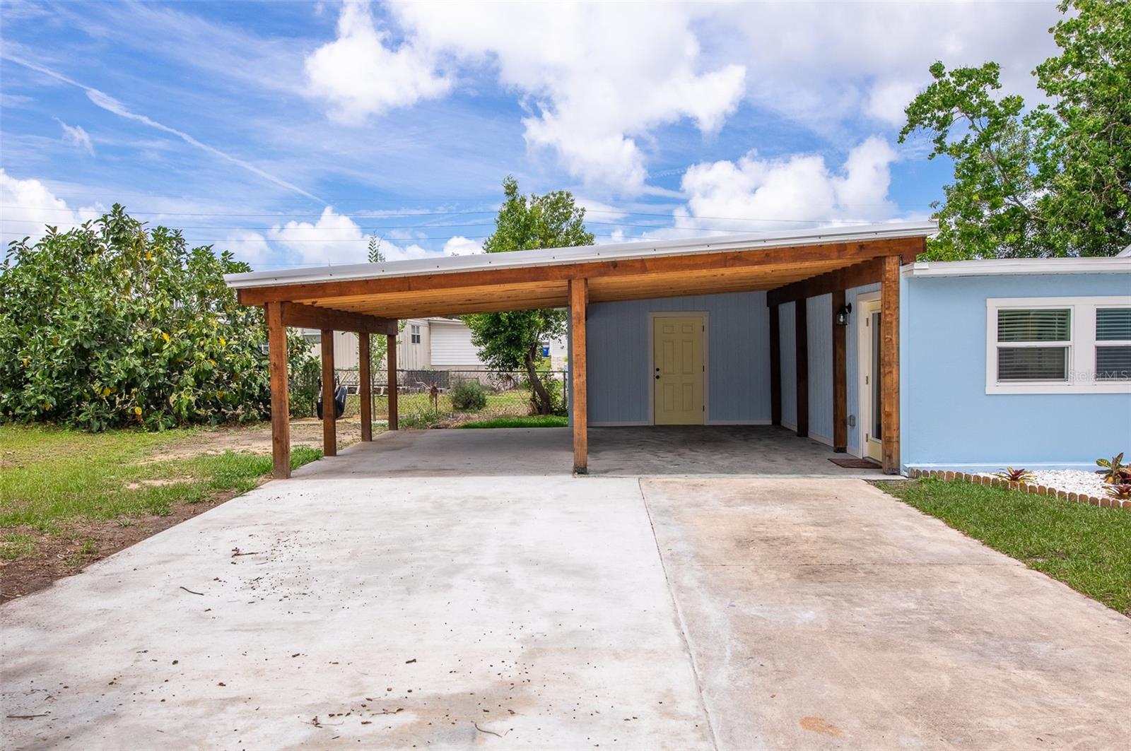 Carport with Plenty of parking for golf cart and cars