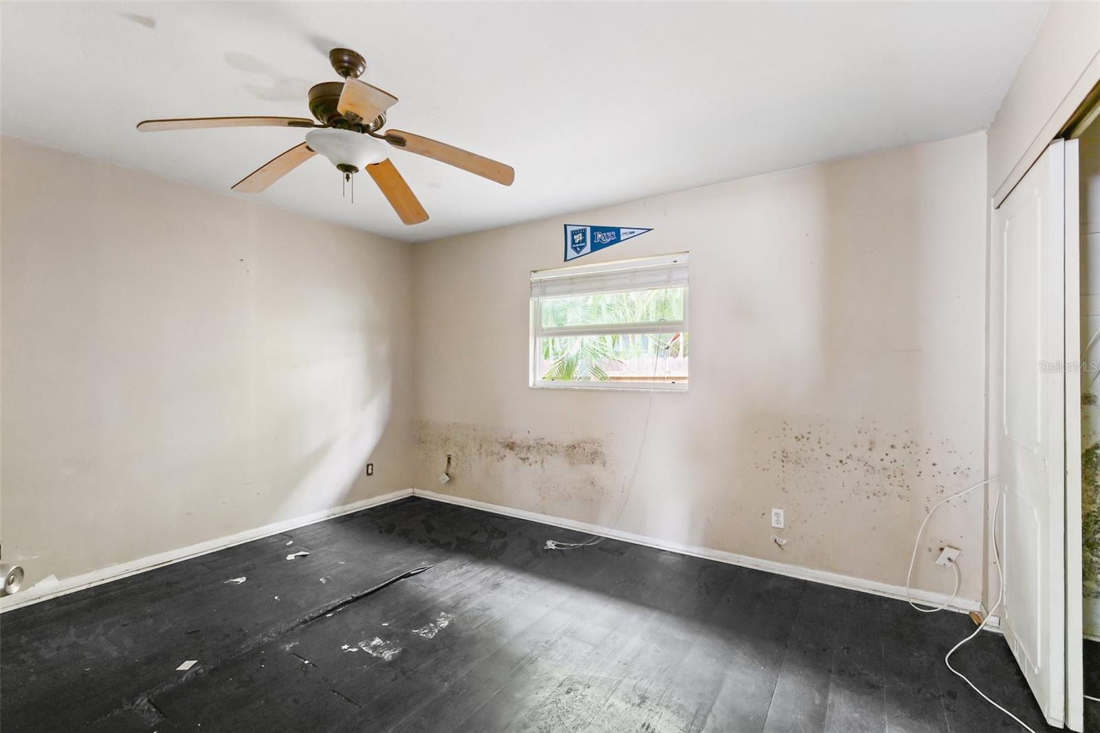 First Level ADA-Compliant Primary Bedroom. Wall adjoined with living room could be brought in making room smaller, but forwarding a larger living room.