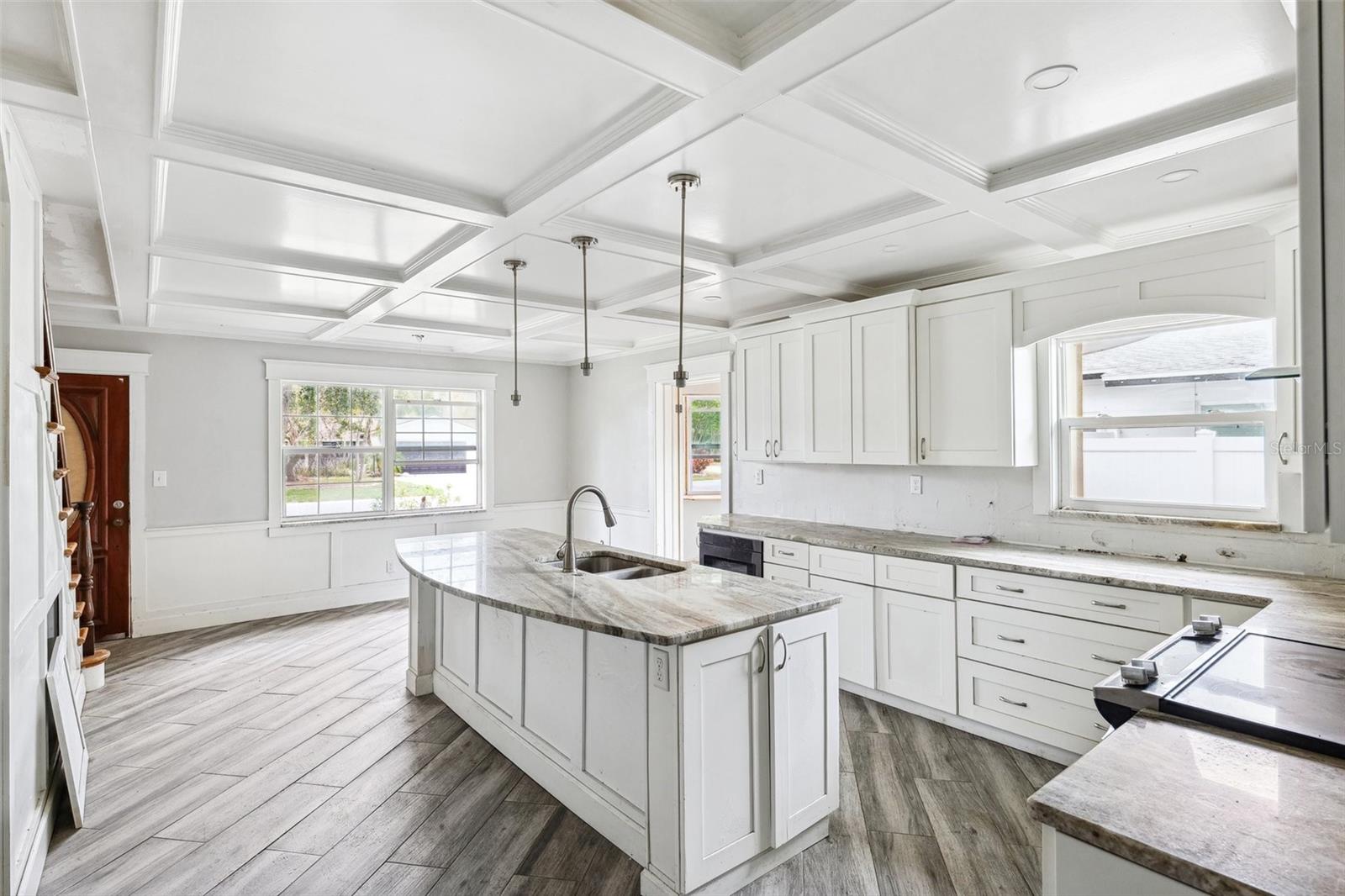 Large open kitchen with hand crafted coffer ceilings
