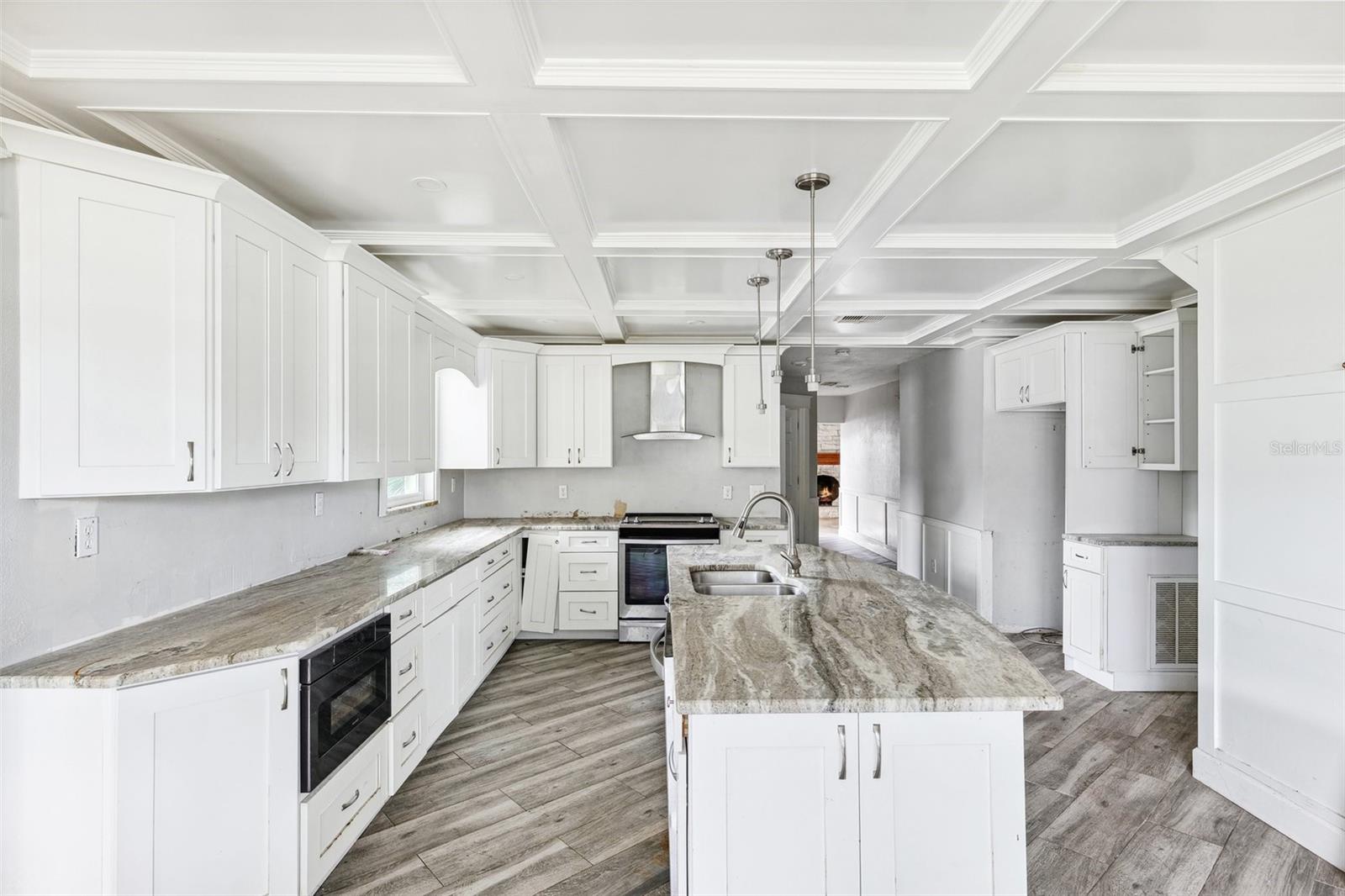 Newly remodeled kitchen with wood cabinets and granite countertops