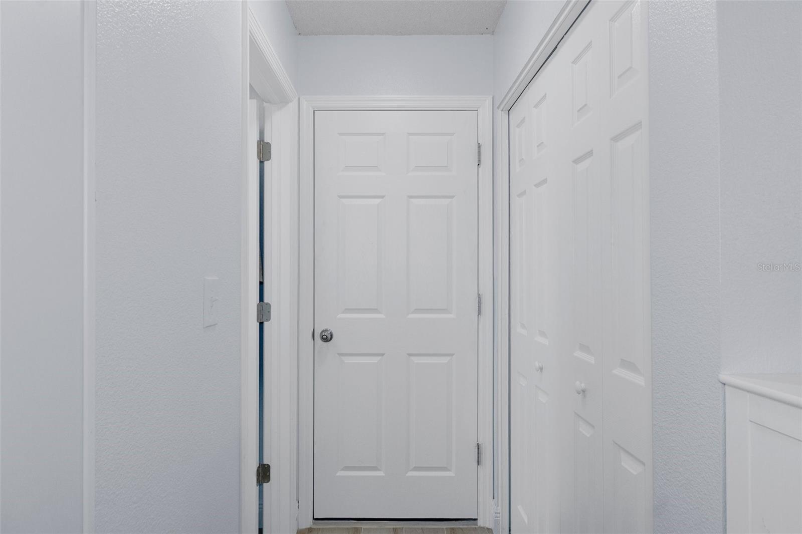 Kitchen Pantry and Door to Garage