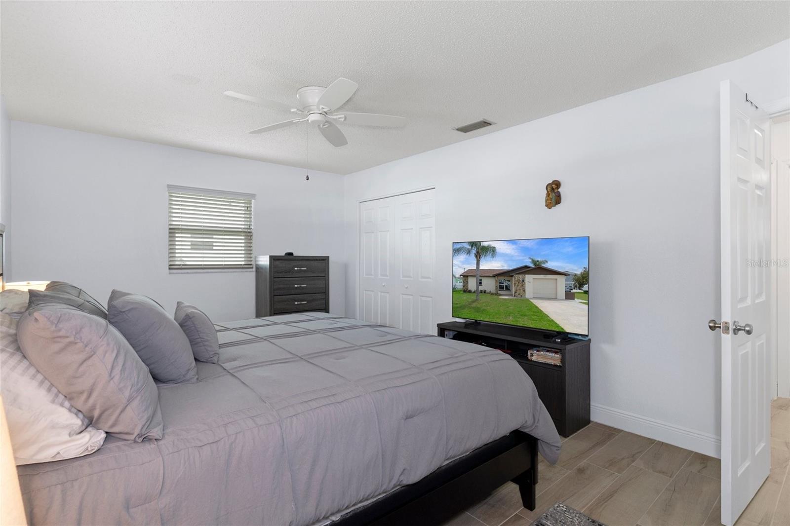 Bedroom 1with NEW Wood Look Tile Plank Flooring
