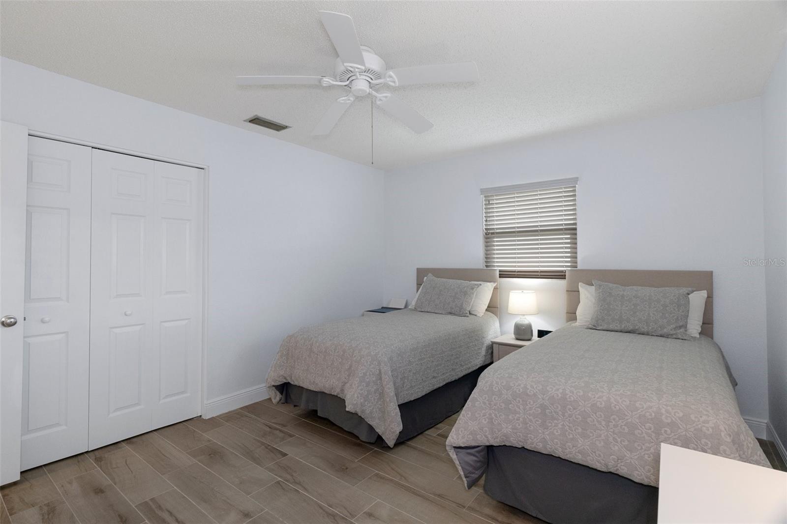 Bedroom 2 with NEW Wood Look Tile Plank Flooring