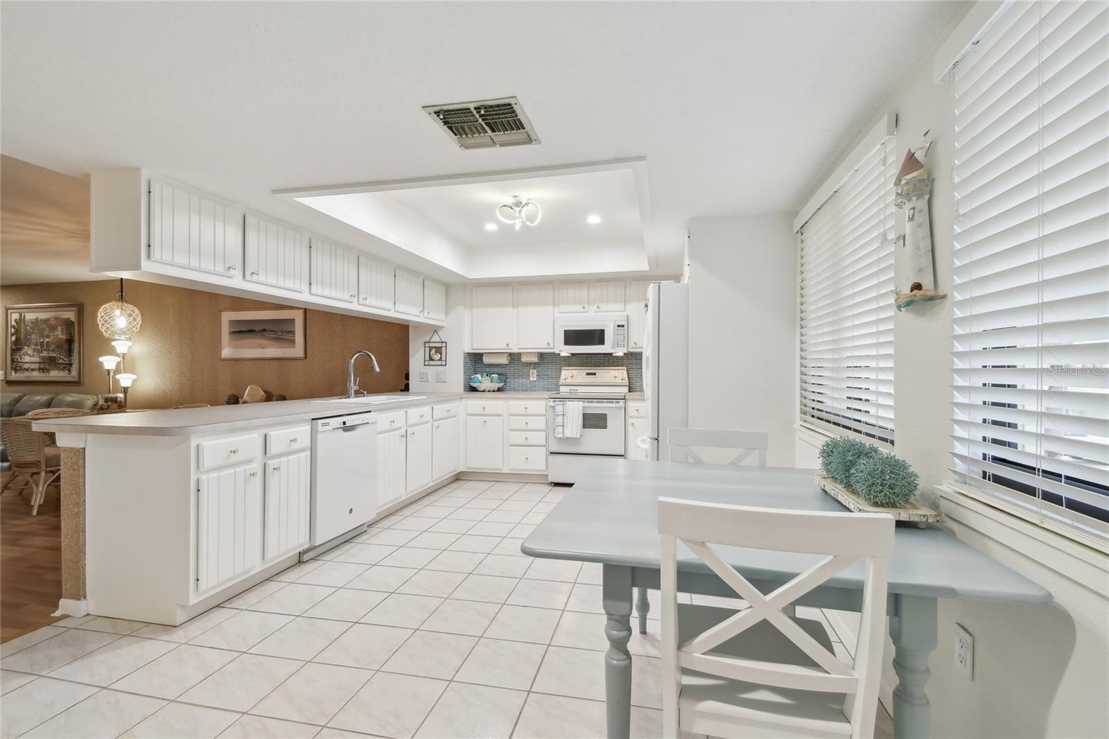 Gorgeous white, coastal kitchen great for entertaining.