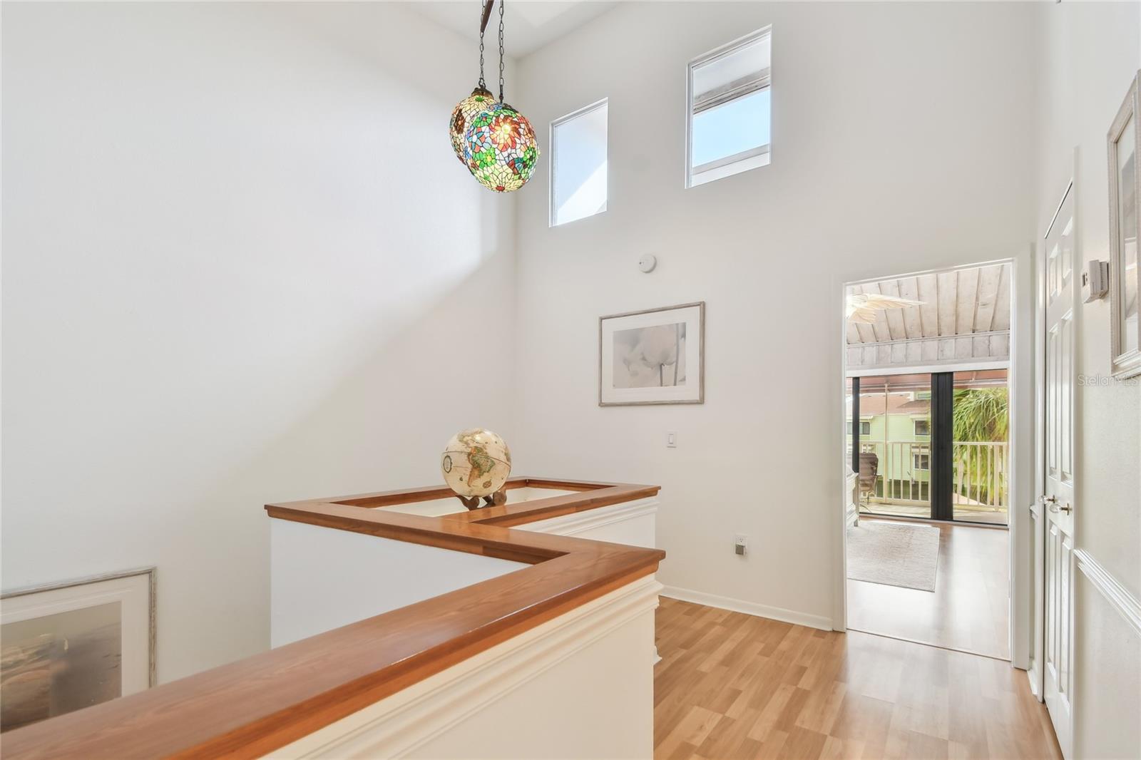Open aire cathedral 3rd floor hallway welcomes the natural sunlight through the clerestory windows..