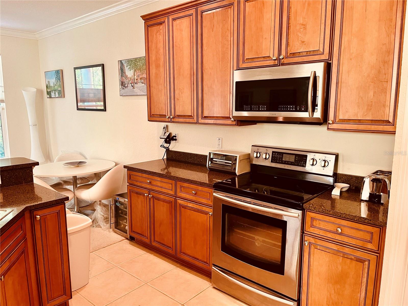High end appliances, granite counters and maple wood cabinets