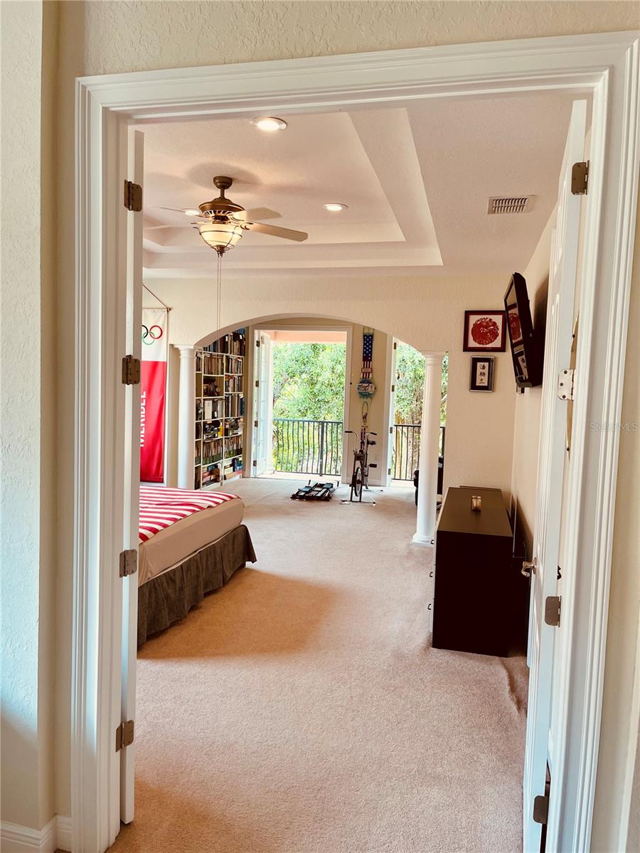 Double 8 ft doors take you from the onus room into the Primary bedroom suite