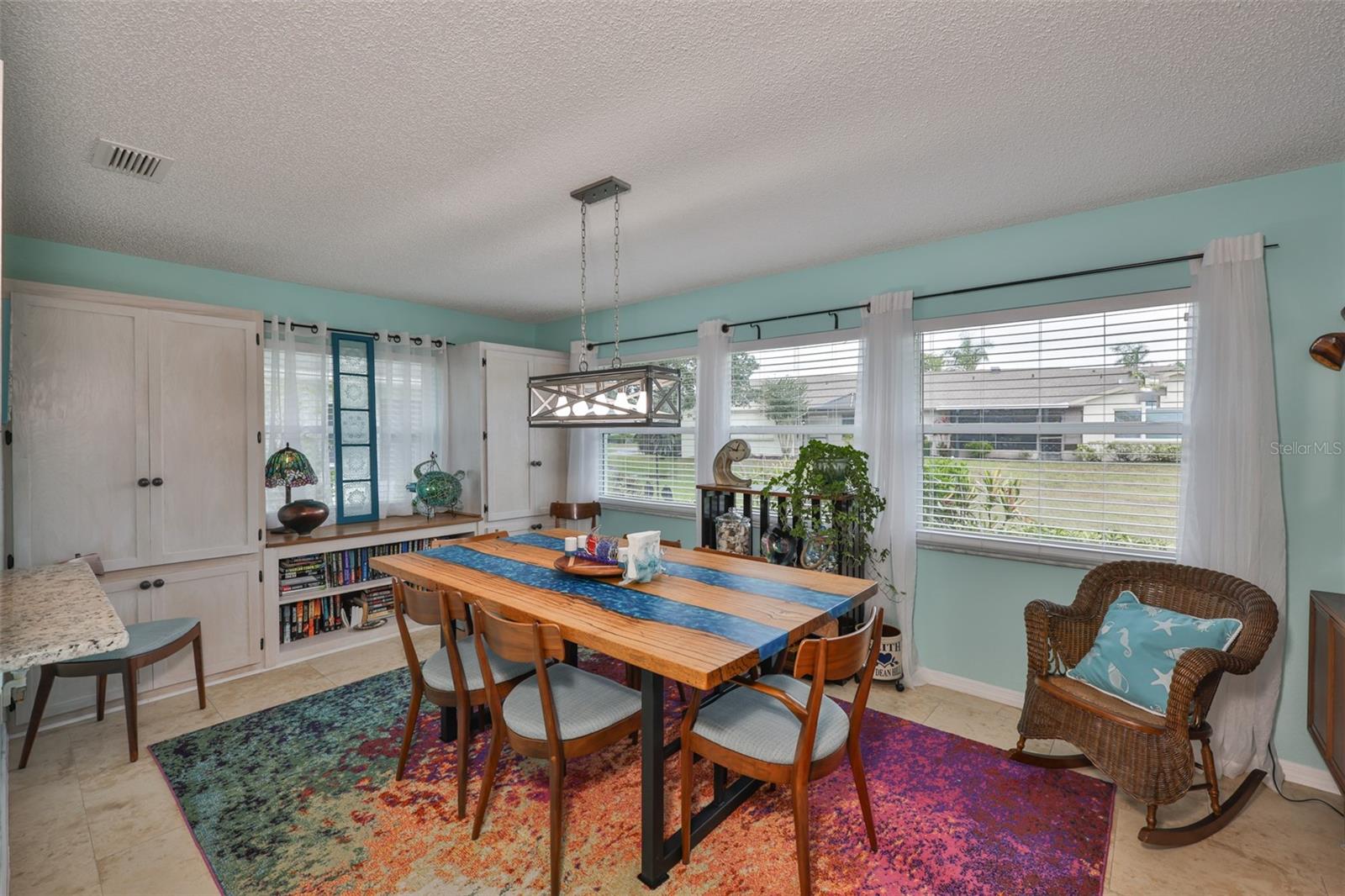 Dining Room with Built in Cabinets & Bookcase with Walnut top