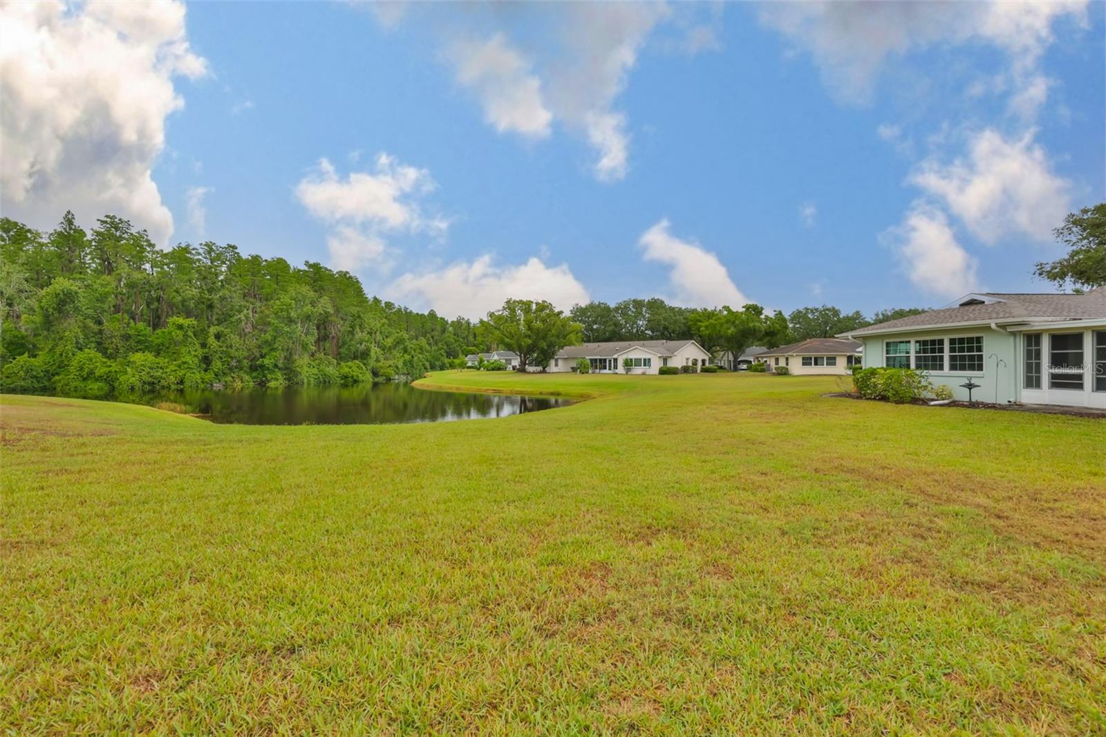 Large land mass between homes with water view