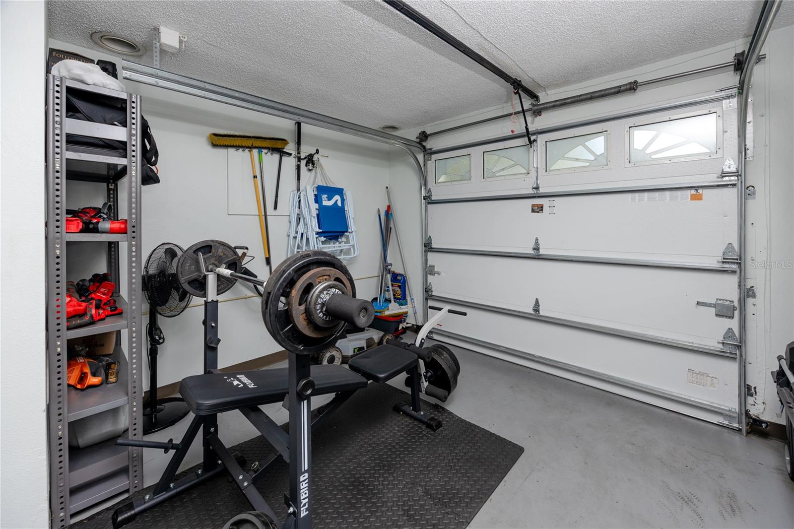 Garage perfect for activity area, storage, or a golf cart!