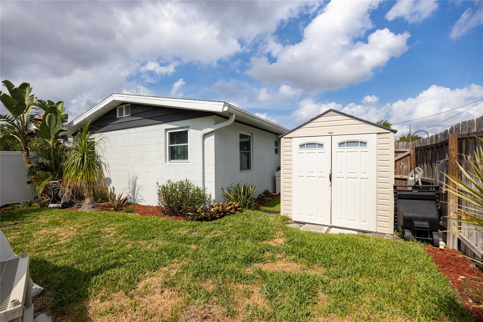 Back yard with sheds for storage