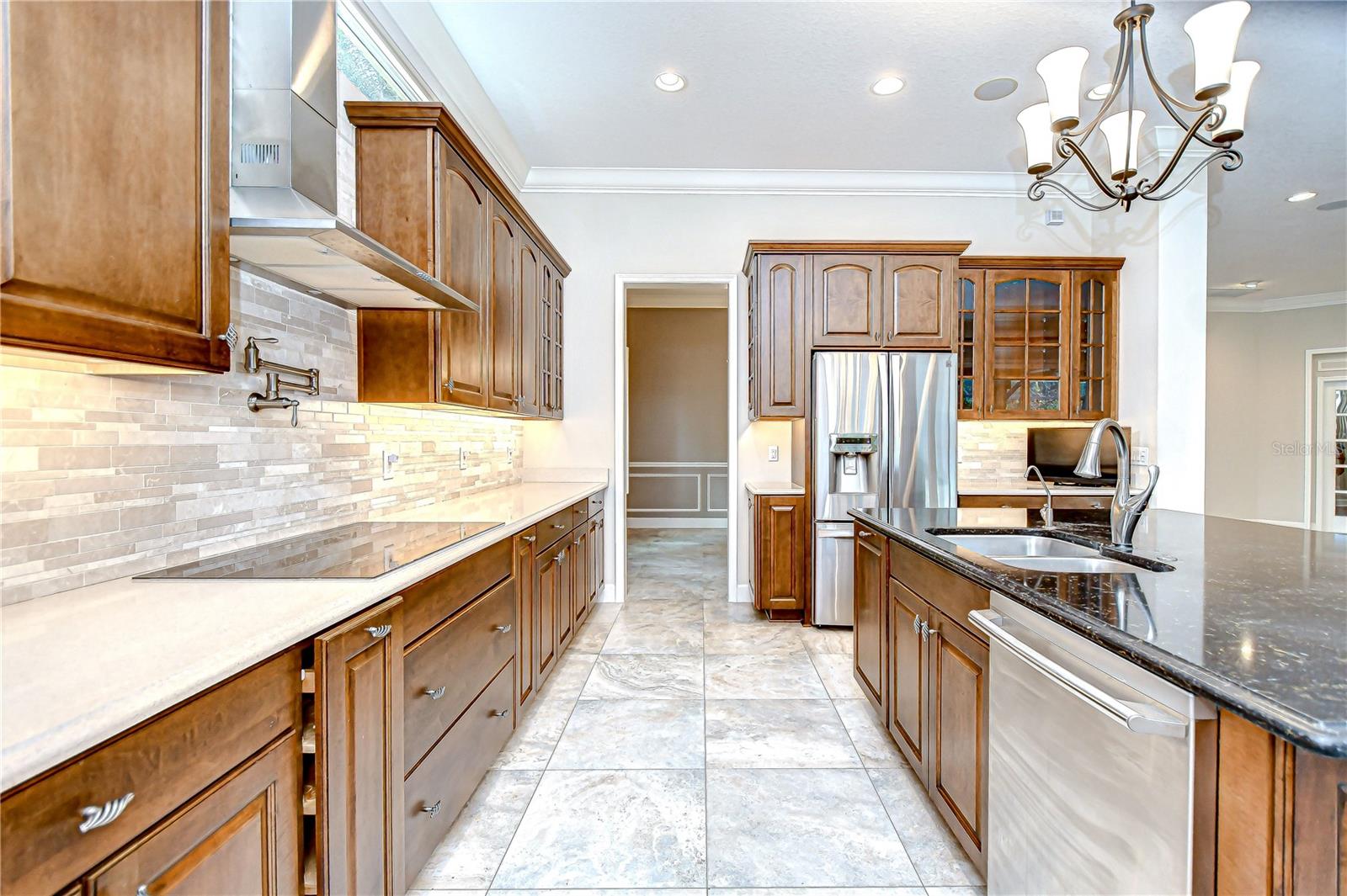 Stone counters, large center island, and built-in appliances!