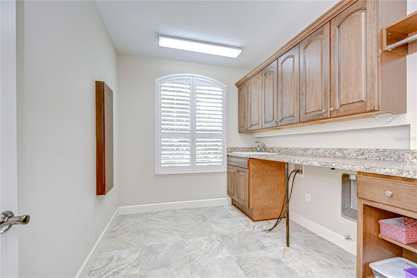 Upstairs laundry room with additional storage!
