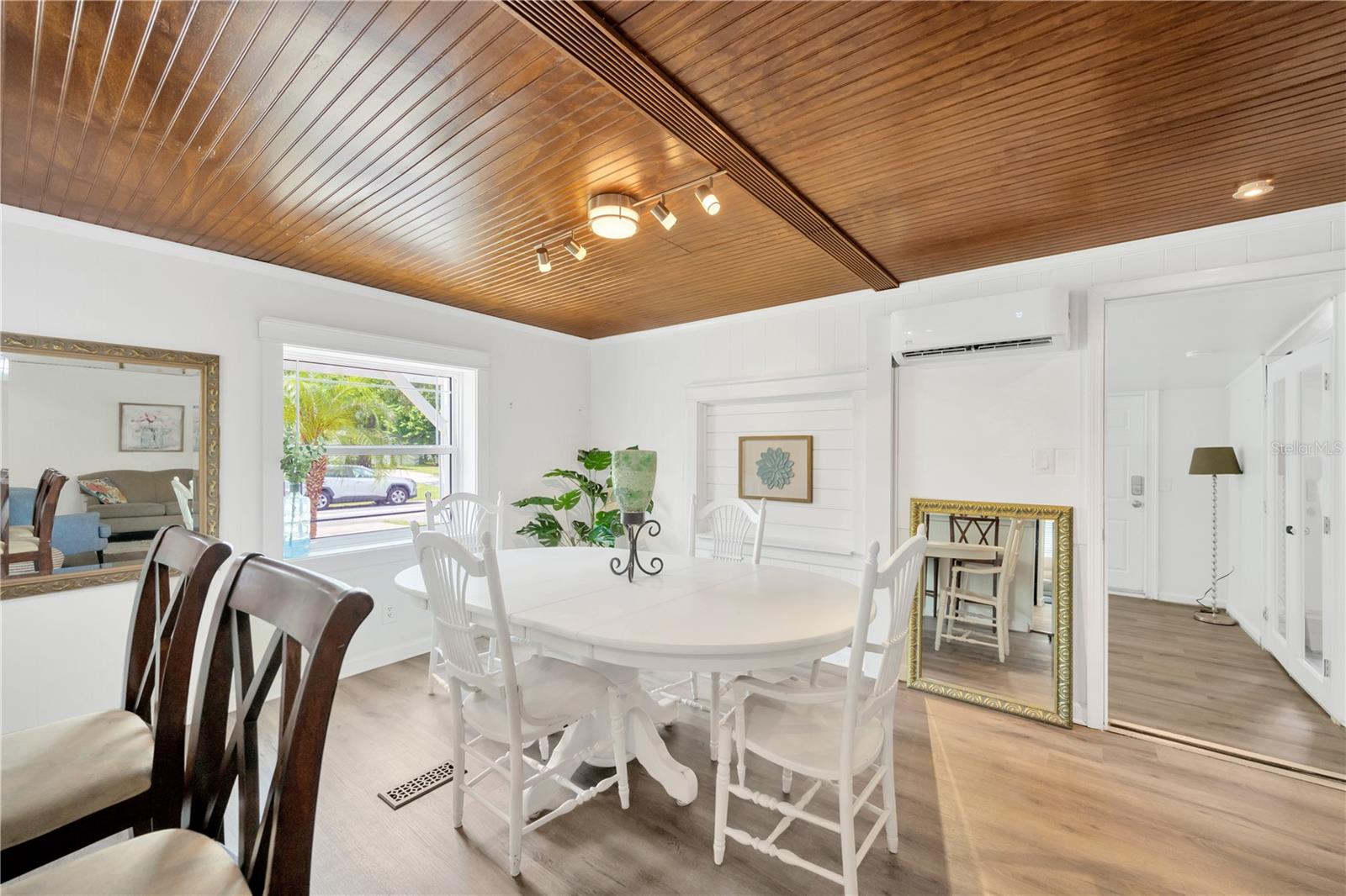 Stunning bead-board wood ceiling, crown molding and creamy white painted shiplap walls for added character throughout this home.