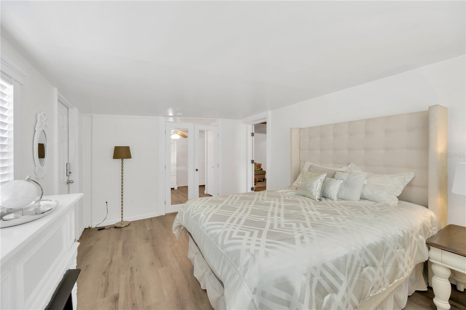 Secondary Bedroom # 2 has a bonus room connected by glass french doors which has a built in closet and would make a perfect sitting room, office or a creative flex space.  This 2 room suite with outside access can be locked away from the main home.