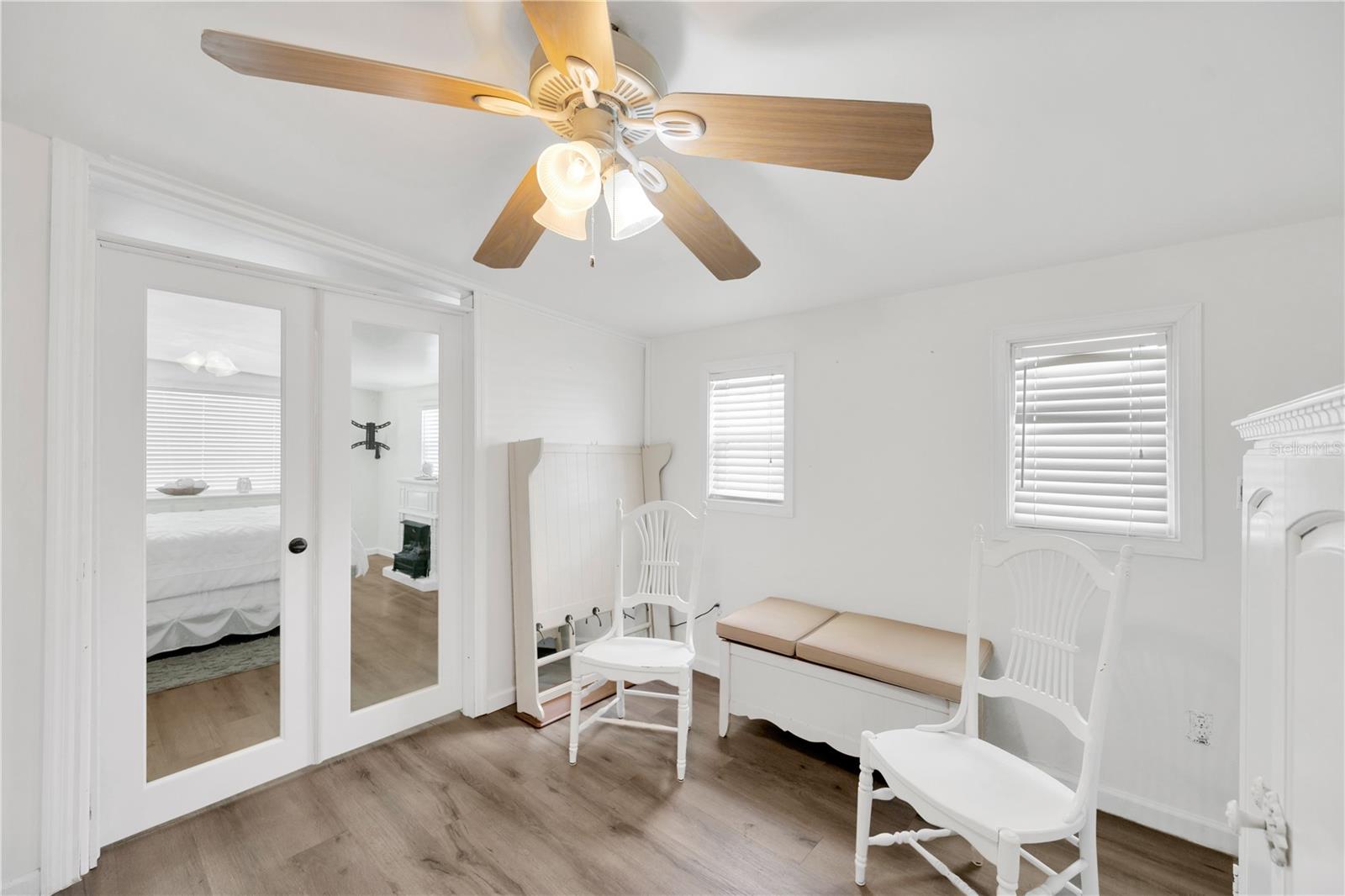 Flexible bonus room next to bedroom #2 divided by elegant glass French doors, has a built-in closet adding even more versatility to the floor plan.