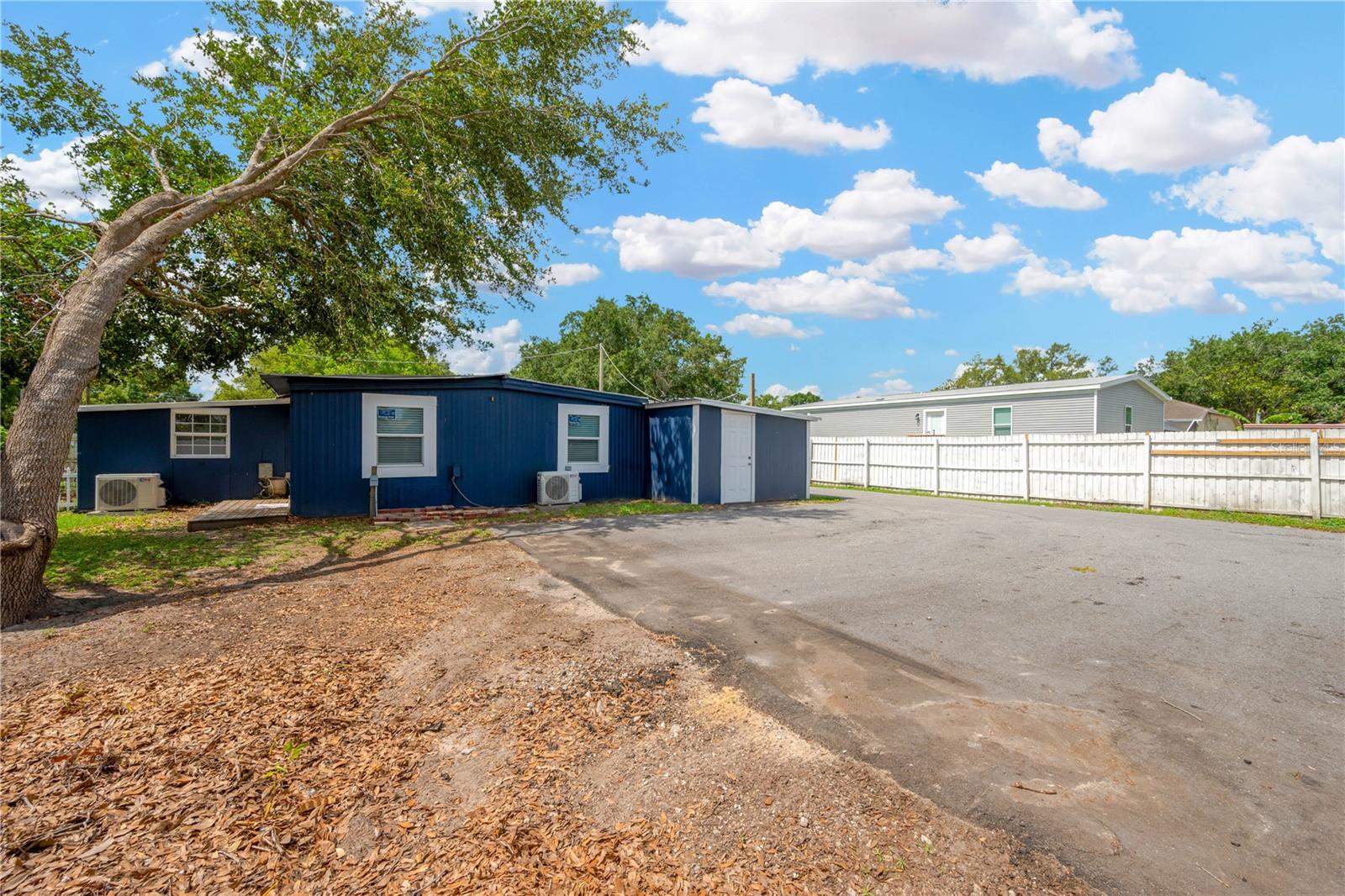 An additional driveway and parking pad in the back yard is perfect to store boats, campers & other equipment with ho HOA restrictions.