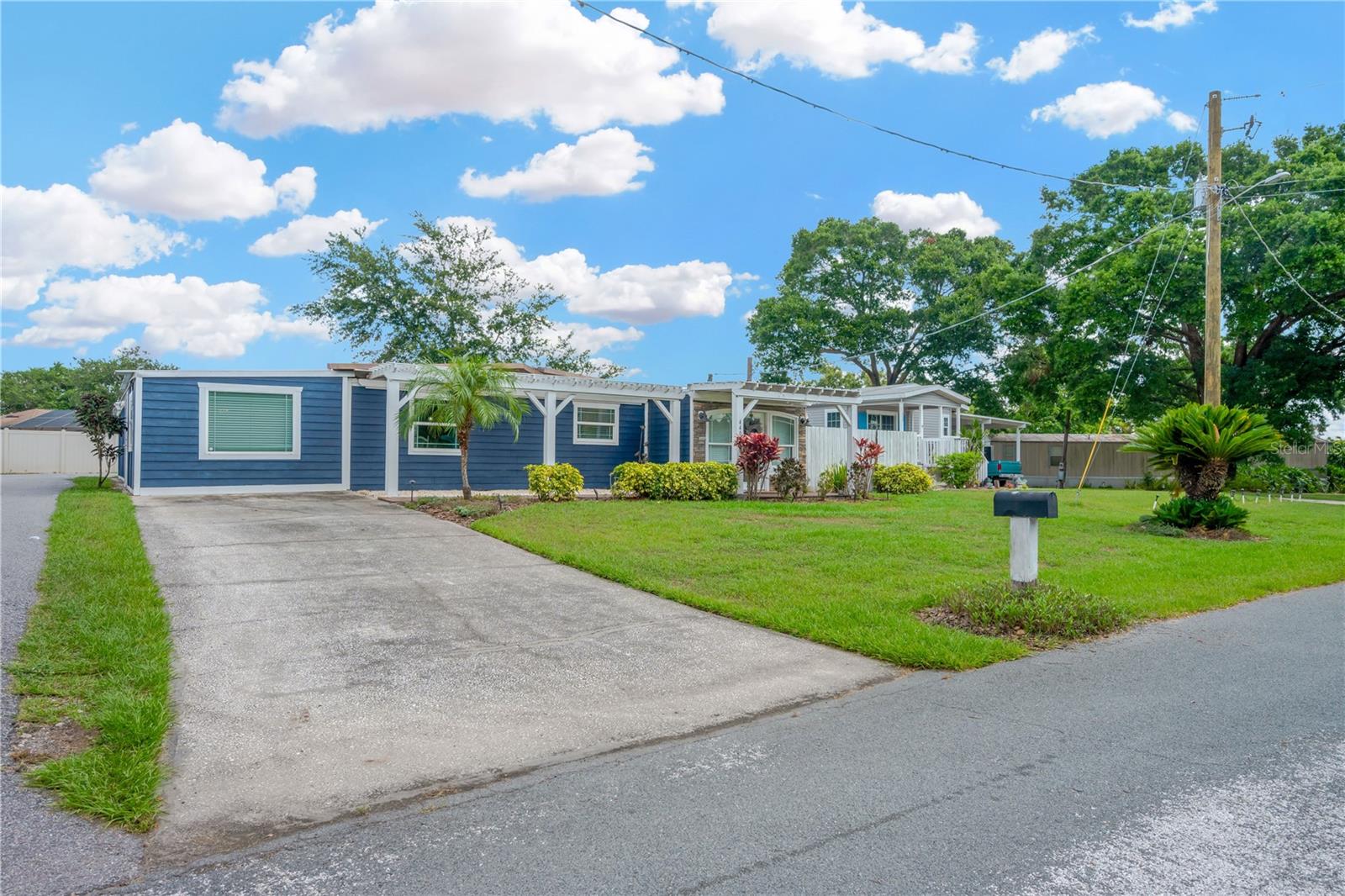 Secluded on a quiet dead-end paved drive off of Durant Road is a peaceful cluster of well maintained, manufactured homes on large manicured lots.  You must see this home to appreciate the charming french country ambiance.