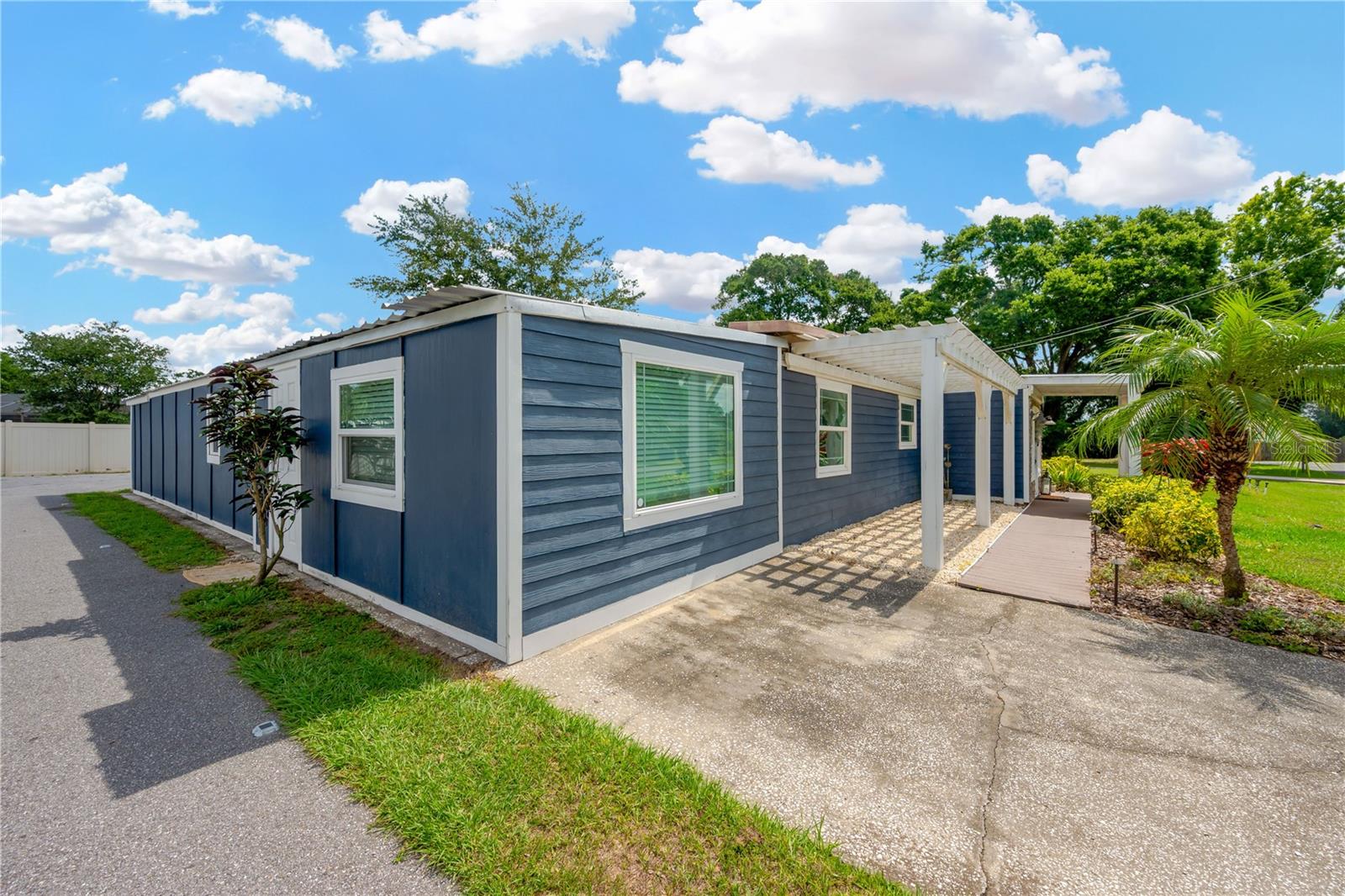 Durable composite deck pathway and pergola add to the charm.  Schedule your showing soon!