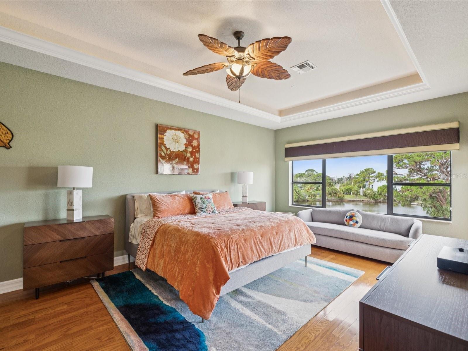 Drop down ceiling with shelf lighting in Primary Bedroom-Engineered HDWD fllors