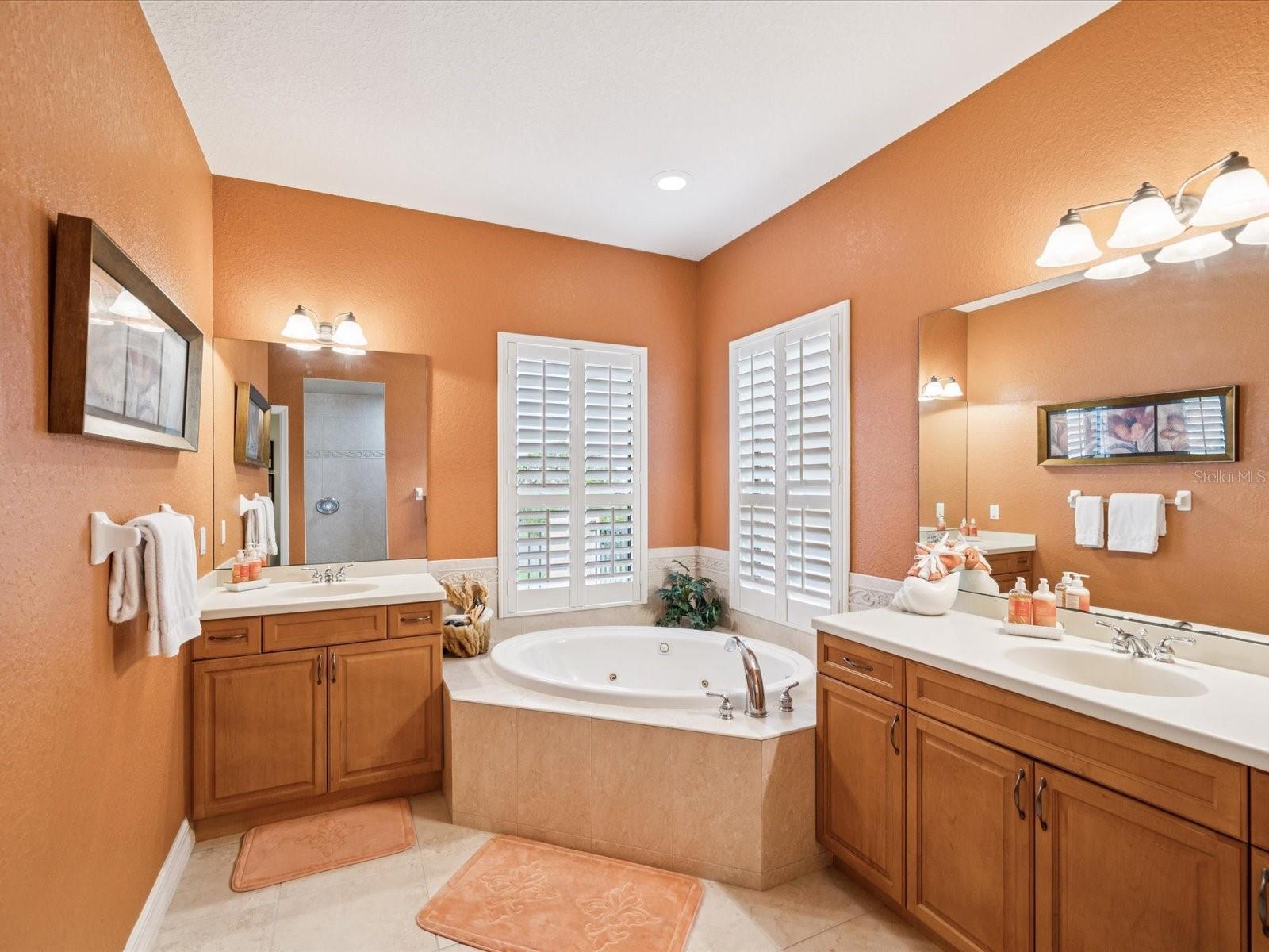 Garden tub with Whirlpool-plantation shutters on window