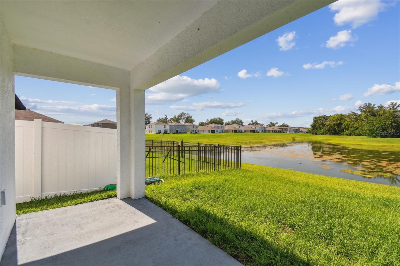 POND VIEW FROM COVERED BACK LANAI - NO REAR NEIGHBORS!