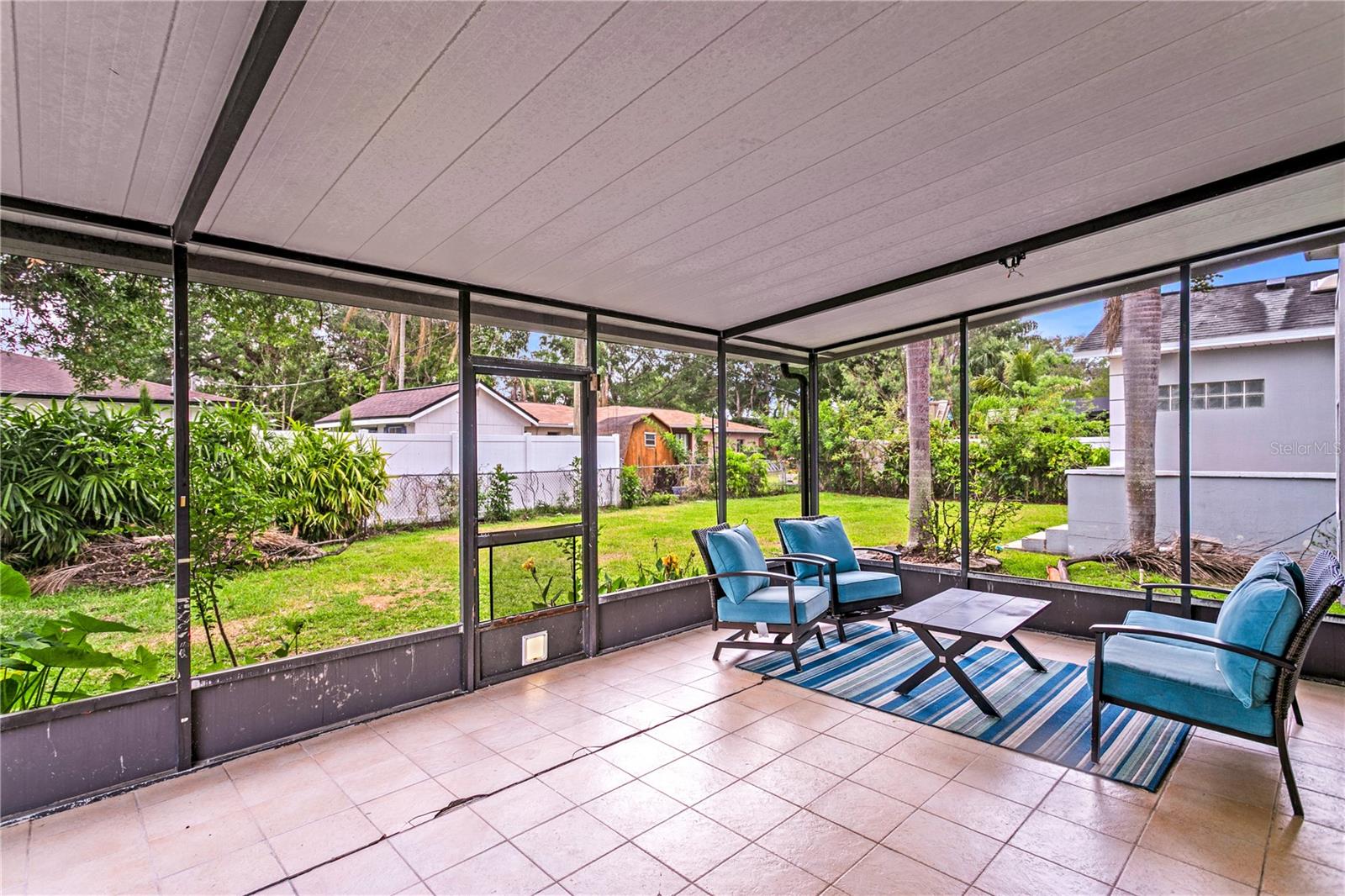 The living room offers direct access the screened-in lanai offers the perfect setting to unwind and enjoy Florida’s beautiful evenings.
