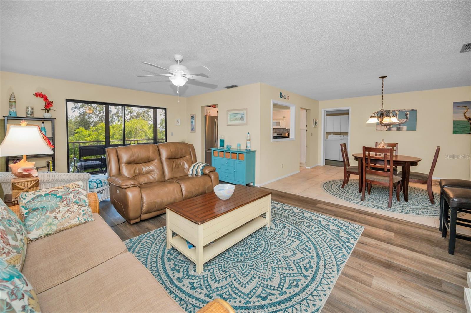 Perfect gathering room with access to screened balcony
