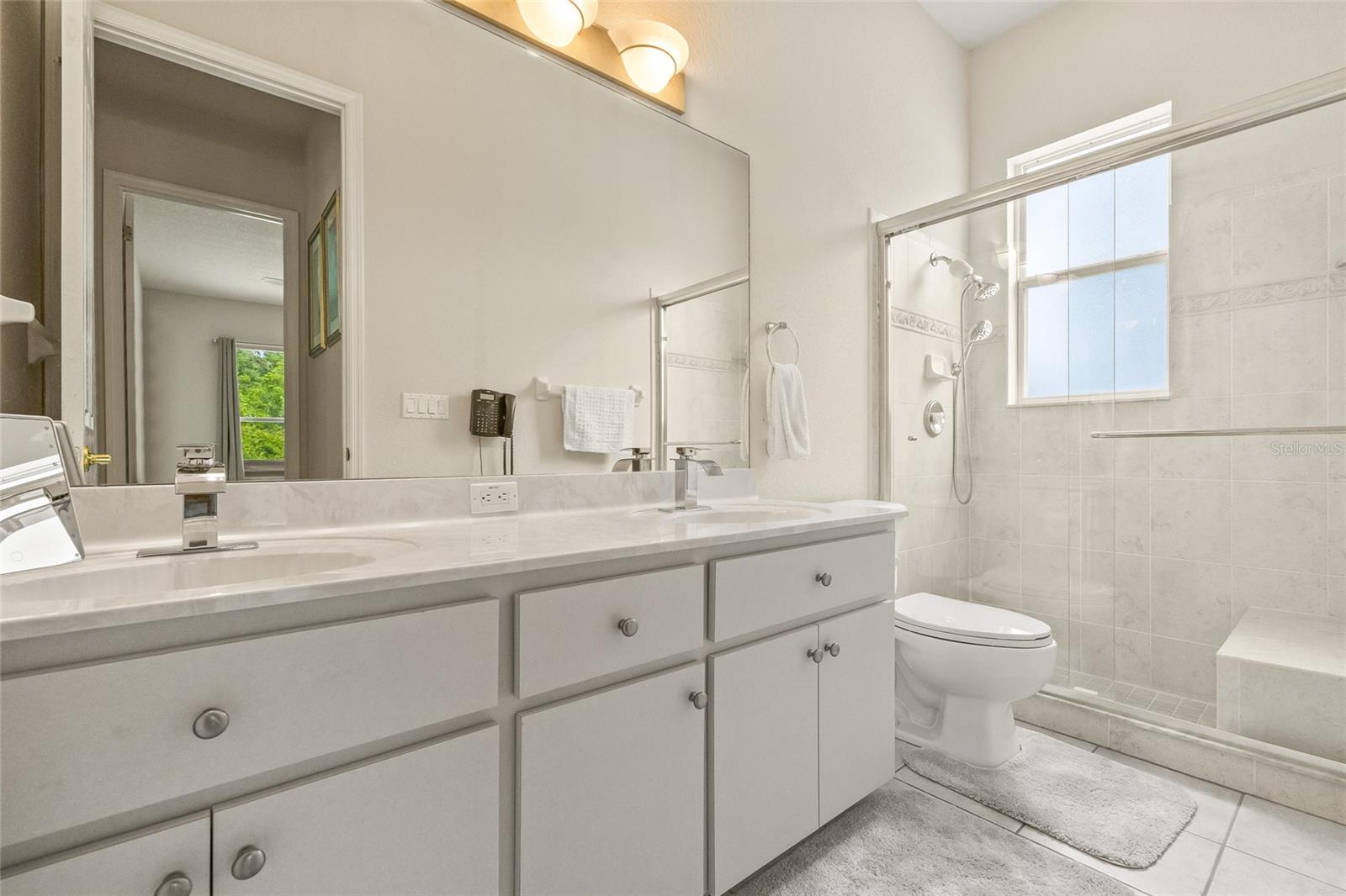 Bathroom 2 - dual vanities and tiled shower