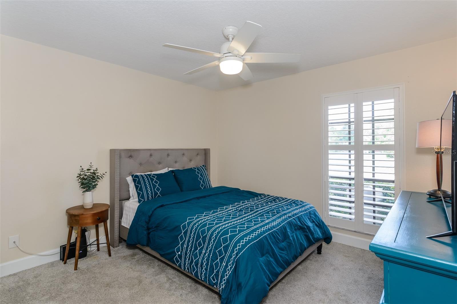Guest bedroom has a walk-in closet and easy access bath just outside the bedroom.