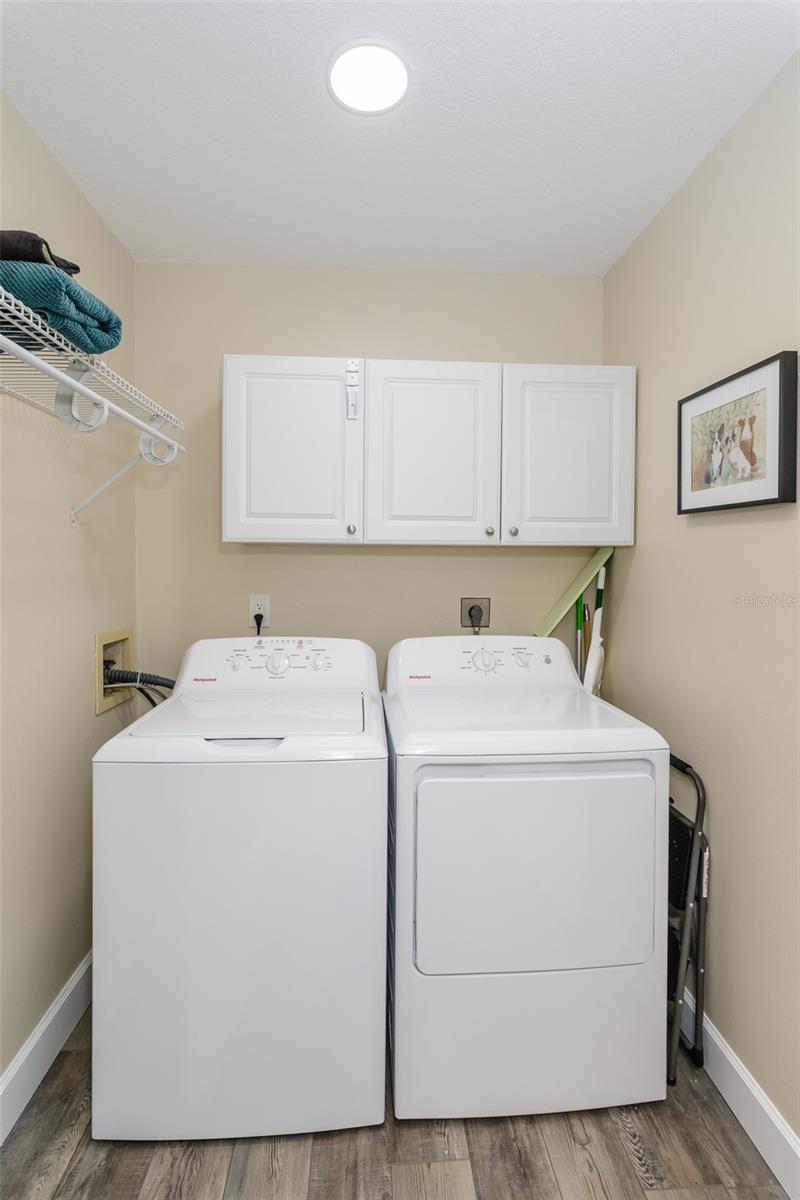 Laundry room with newer washer & dryer.