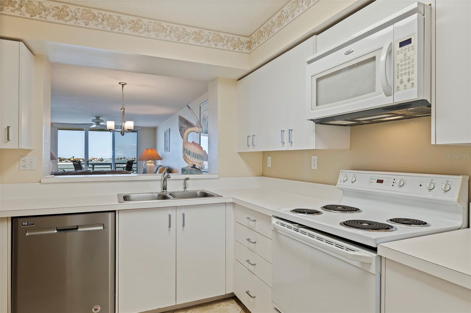 Spacious kitchen with pass through to dining area