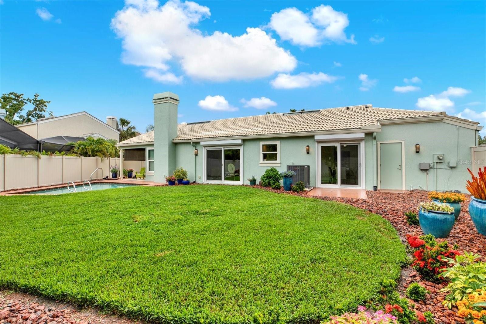 Mega Backyard. Fenced. Private. Landscaped. And the Grass feels AMAZING on your Feet !