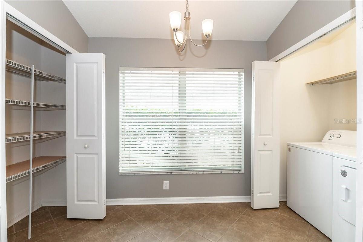 Eating space in kitchen with pantry and laundry closet