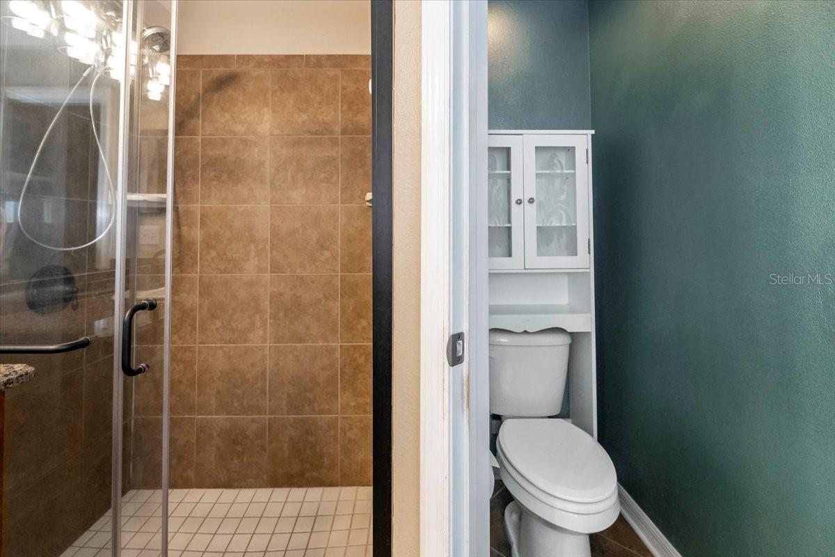 Primary en suite bath with separate water closet