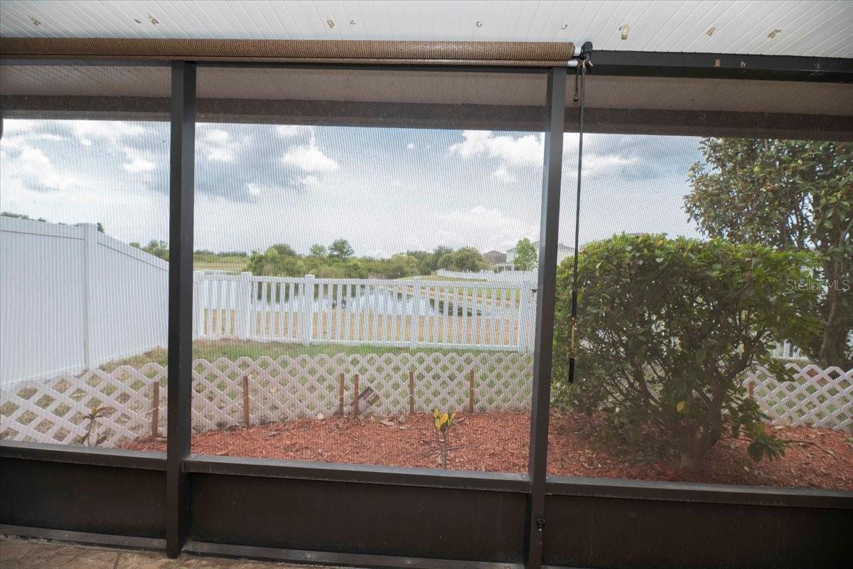 Screened rear lanai overlooking the pond