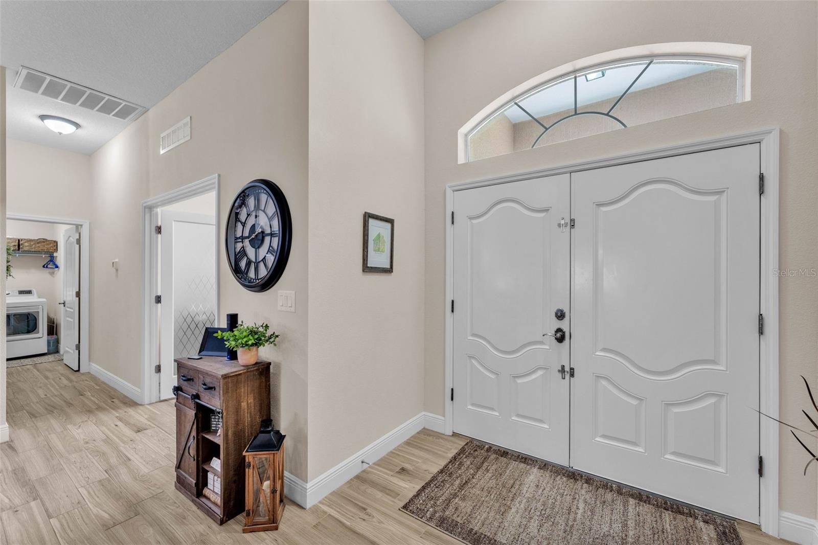 Front door, Office to the right of front door, followed by the laundry room