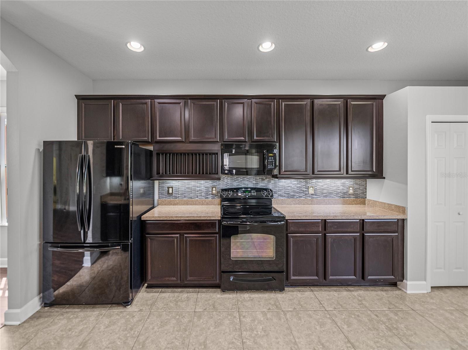 View of kitchen from bar