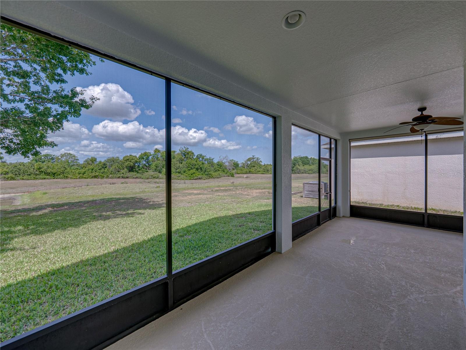 Screened lanai with conservation/pond view
