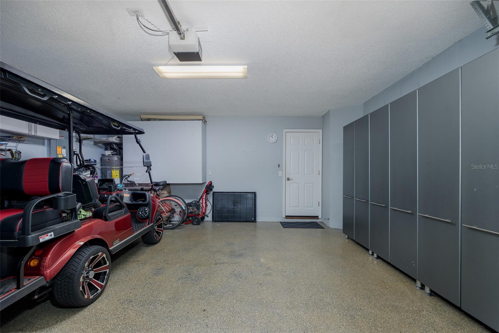 Garage with storage and coated flooring